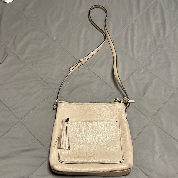 kate spade Handbags - Kate Spade Cream Leather Crossbody with Front Pocket Adjustable Strap Flawed